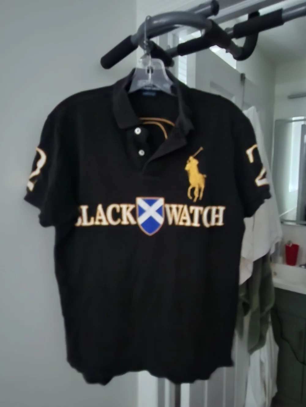 Ralph Lauren Black Polo with Gold Crest and Blue Shield. S-M